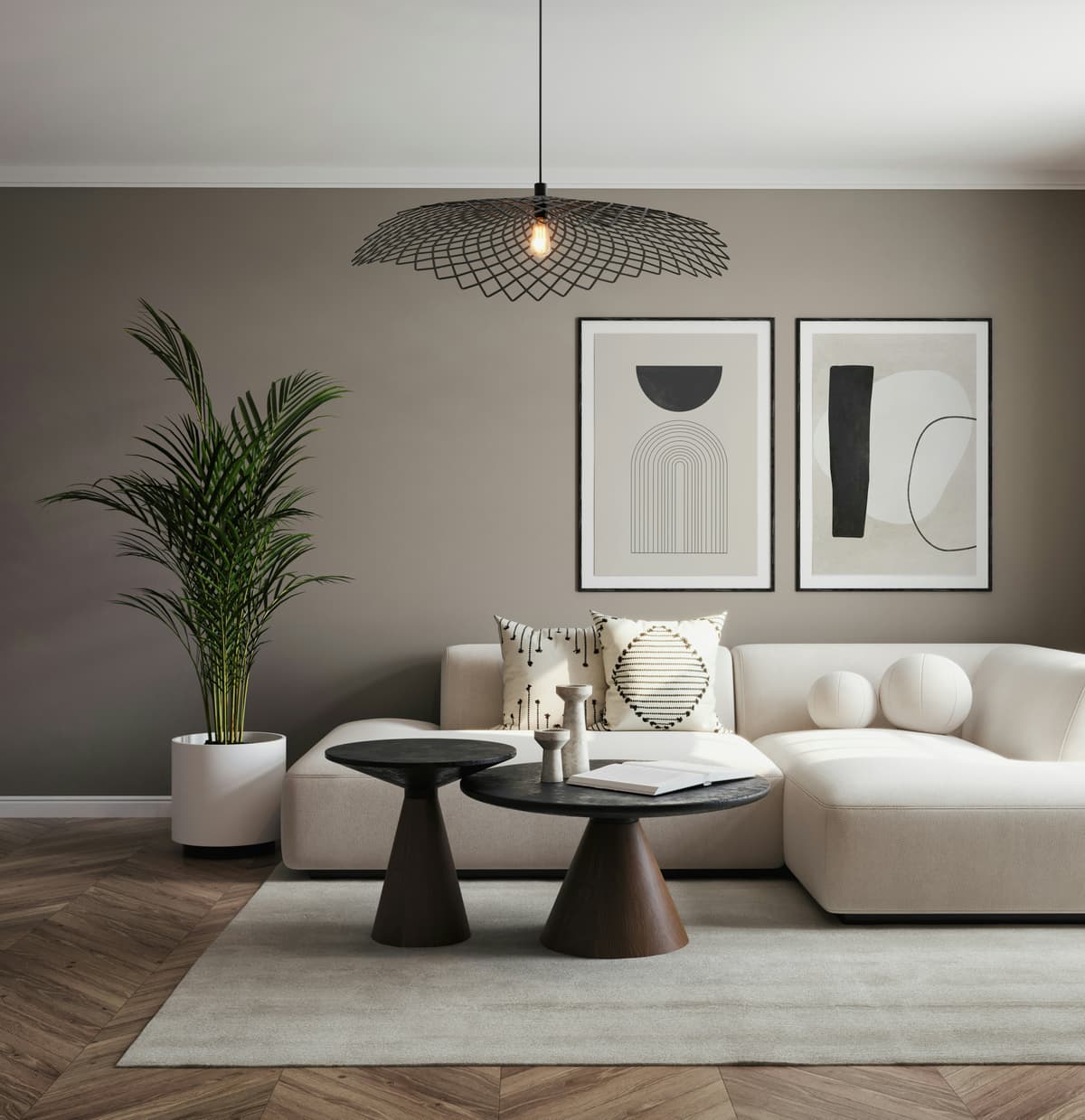 Living room with warm taupe painted walls, framed artwork and a pendant light